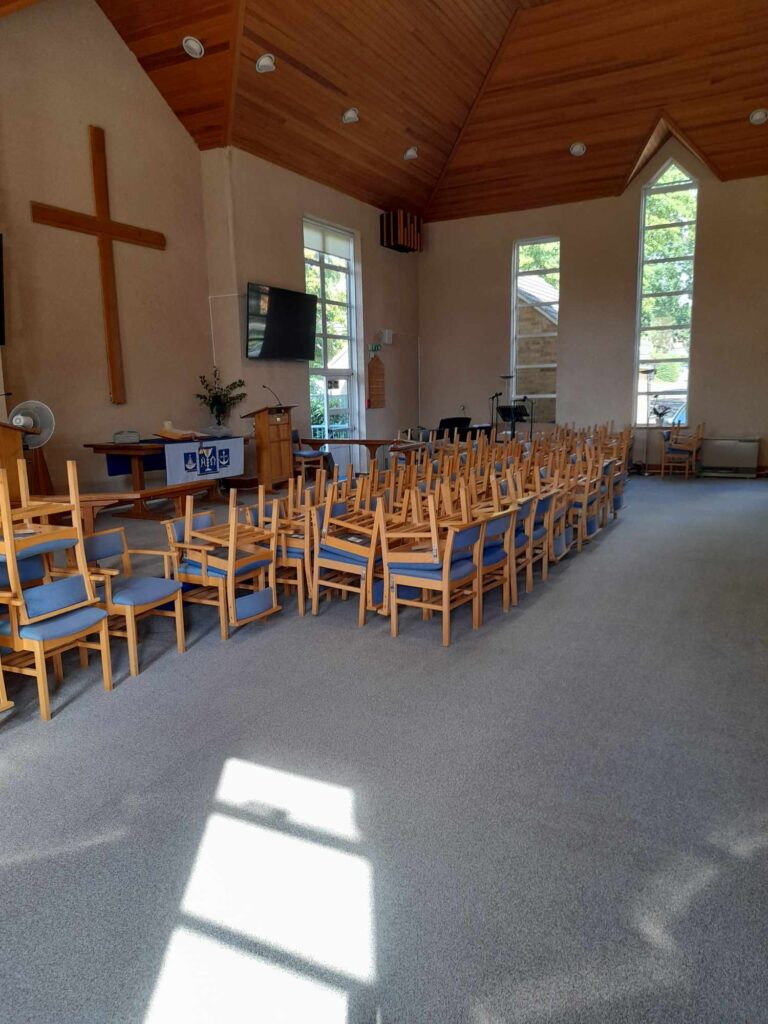 large carpeted area inside the church in need of professional carpet cleaning