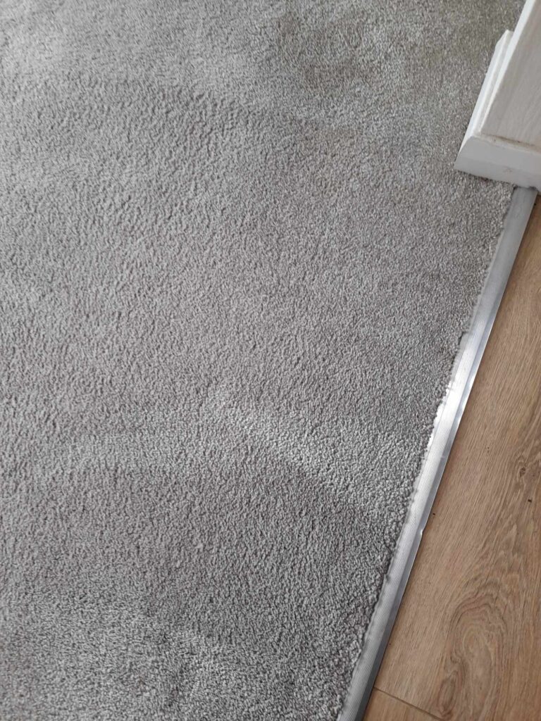 a solvent was applied and the carpet fibres carefully cleaned to restore this carpet back to it's former glory