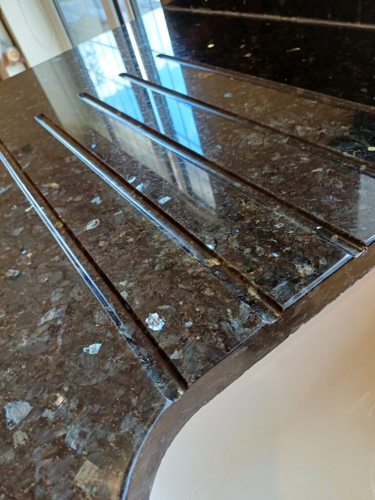 clean and shiny granite and quartz work surface - all stains removed - after specialist cleaning